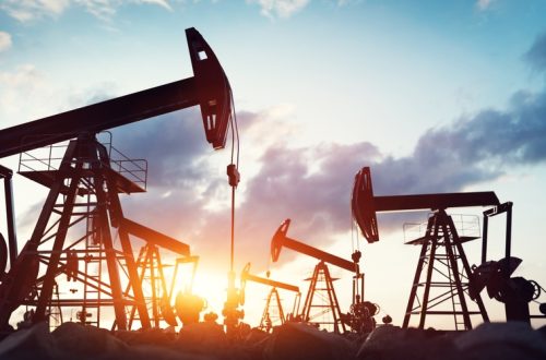 Silhouetted,Oil,Pumps,Against,A,Twilight,Sky.,Oil,Industry.,3d